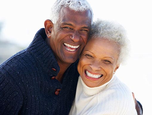 elderly couple smiling4 | Pollock Advanced Dental Group elderly couple smiling outdoors